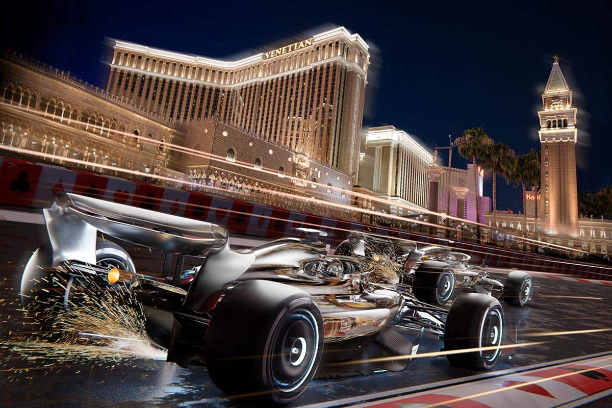 A Formula 1 race car driving down the Las Vegas Strip with sparks flying, and The Venetian Resort in the background. 
